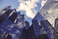 Image: upward view of skyscrapers. Topic: Break up with your mega-bank