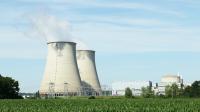 Image: nuclear energy plant smokestacks emitting pollution.