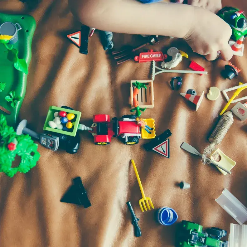 Image: toys scattered on couch. Topic: Beyond Lead: Toxins in Toys