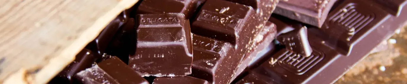 Image: crate of chocolate. Topic: Put Down That Big-Name Chocolate - Grab These Fair Trade Chocolate Bars Instead!